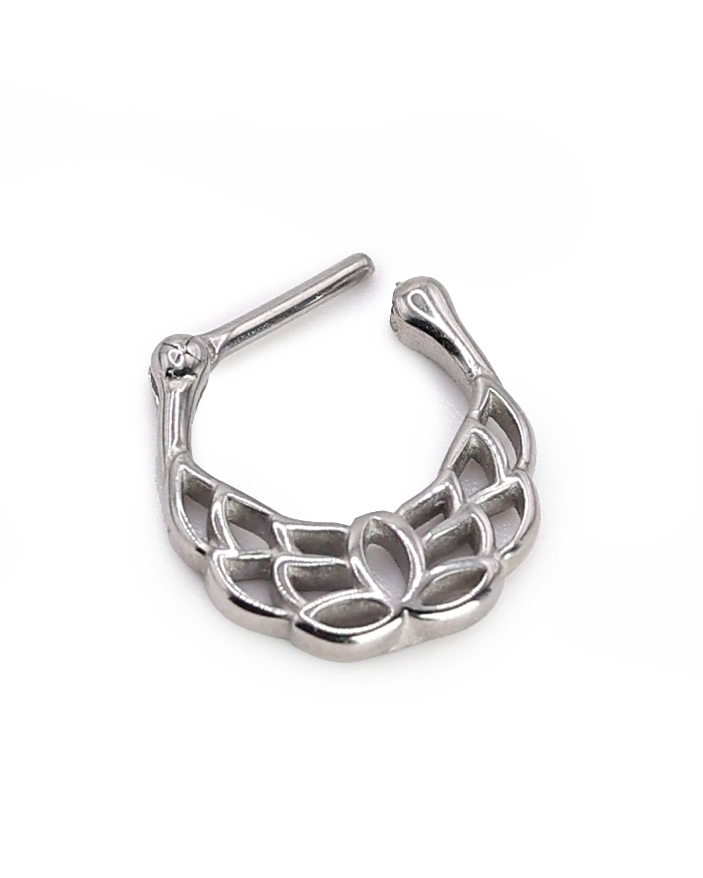 Close-up of a silver septum clicker with a lotus-inspired design, showcasing intricate petal details and a secure hinged clasp on a white background.