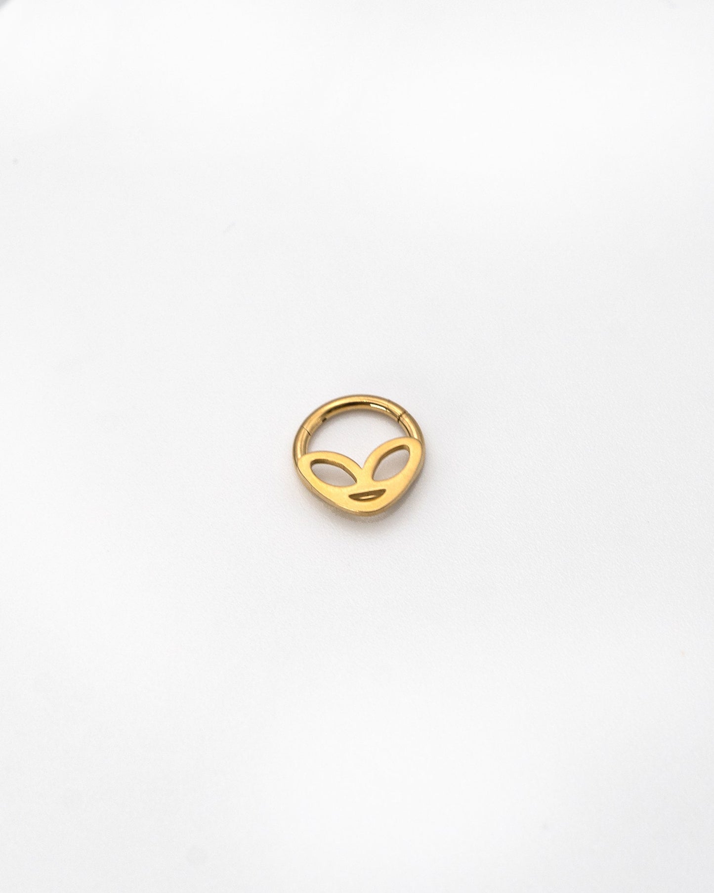 Alien-themed septum clicker in Gold finish, displayed on a white background.