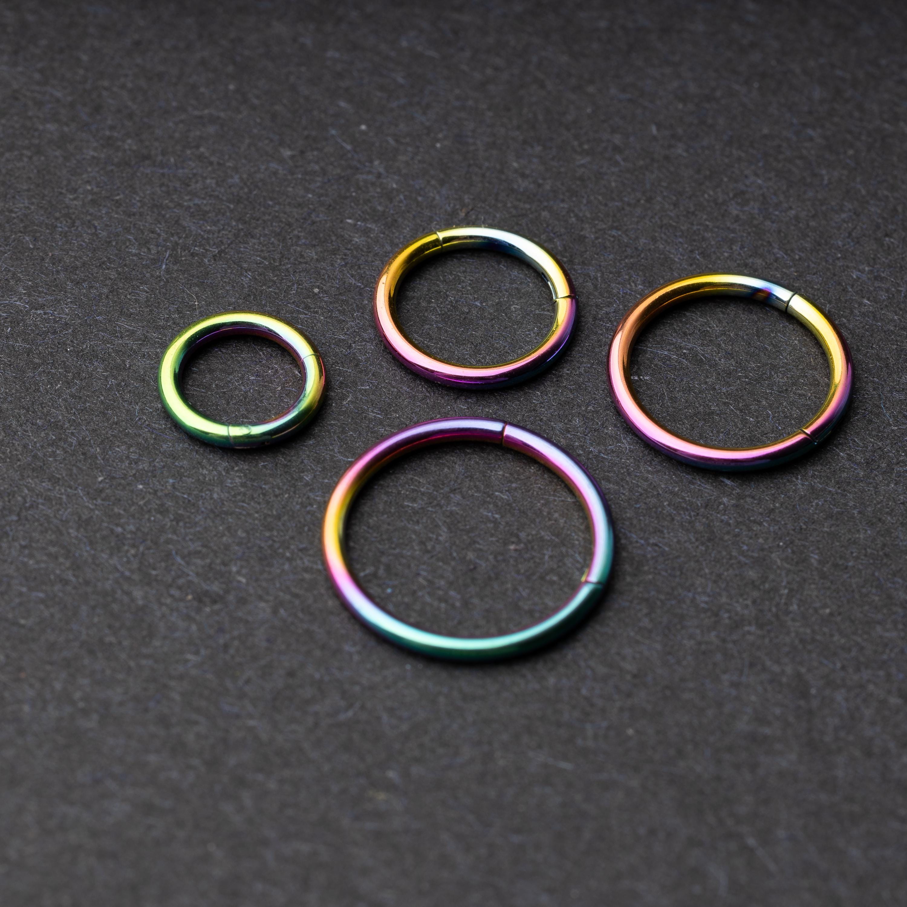 Seamless Clicker hoop in rainbow, showcasing four different sizes displayed on a dark background