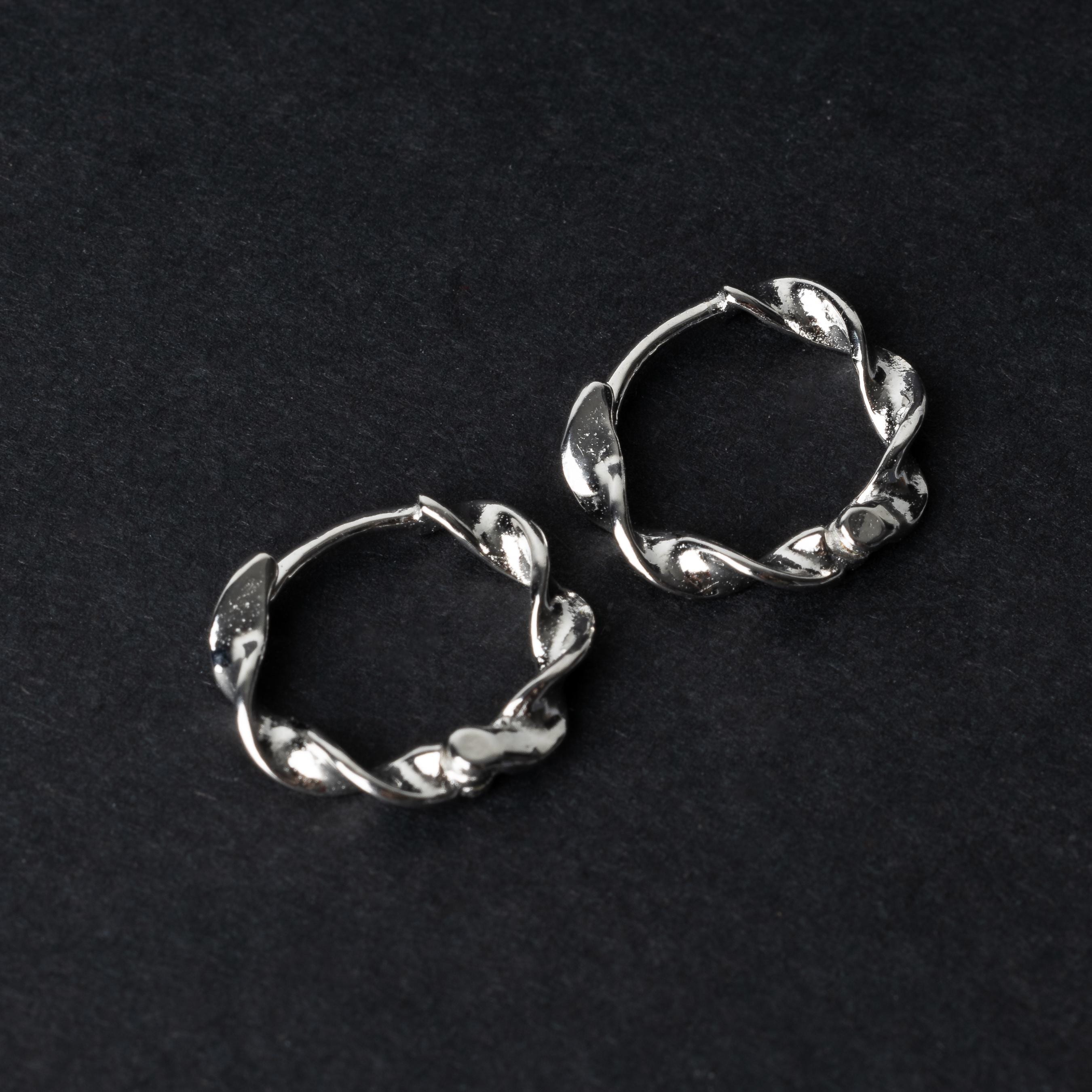 Gold-toned twisted rope design clickers made from 925 sterling silver, displayed on a black background.