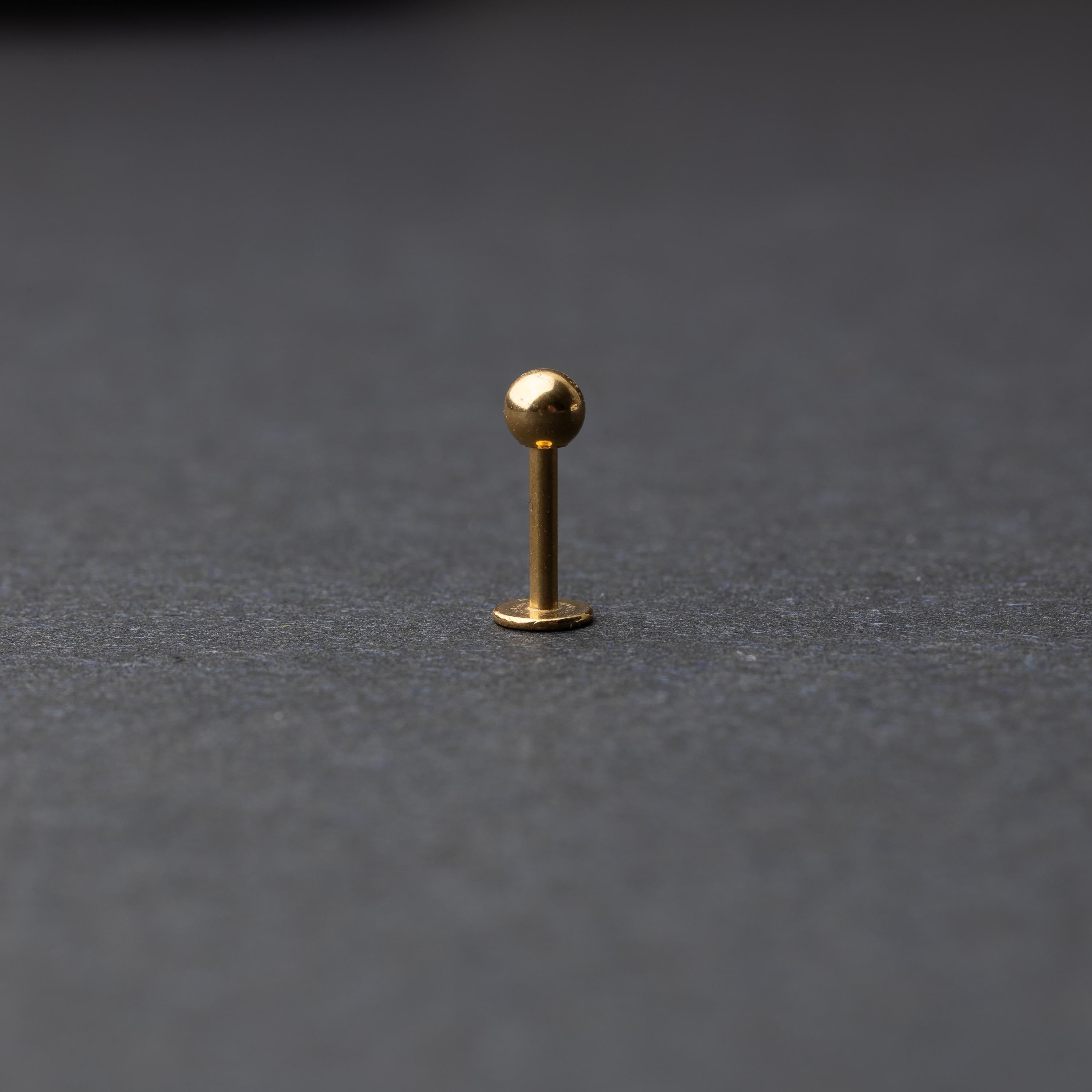 Gold Flat Back Bar shown on a dark background