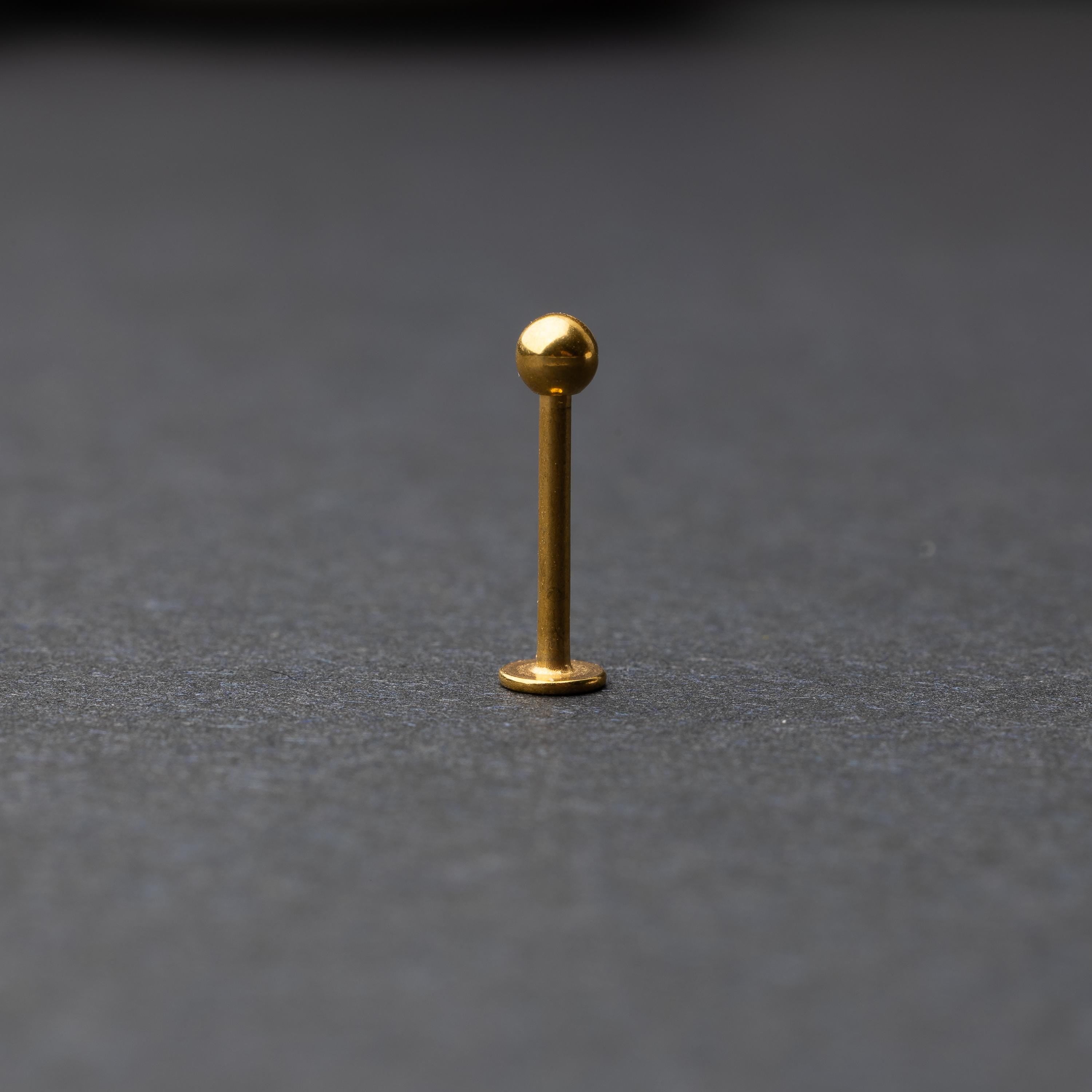 Gold Flat Back Bar displayed on a dark background