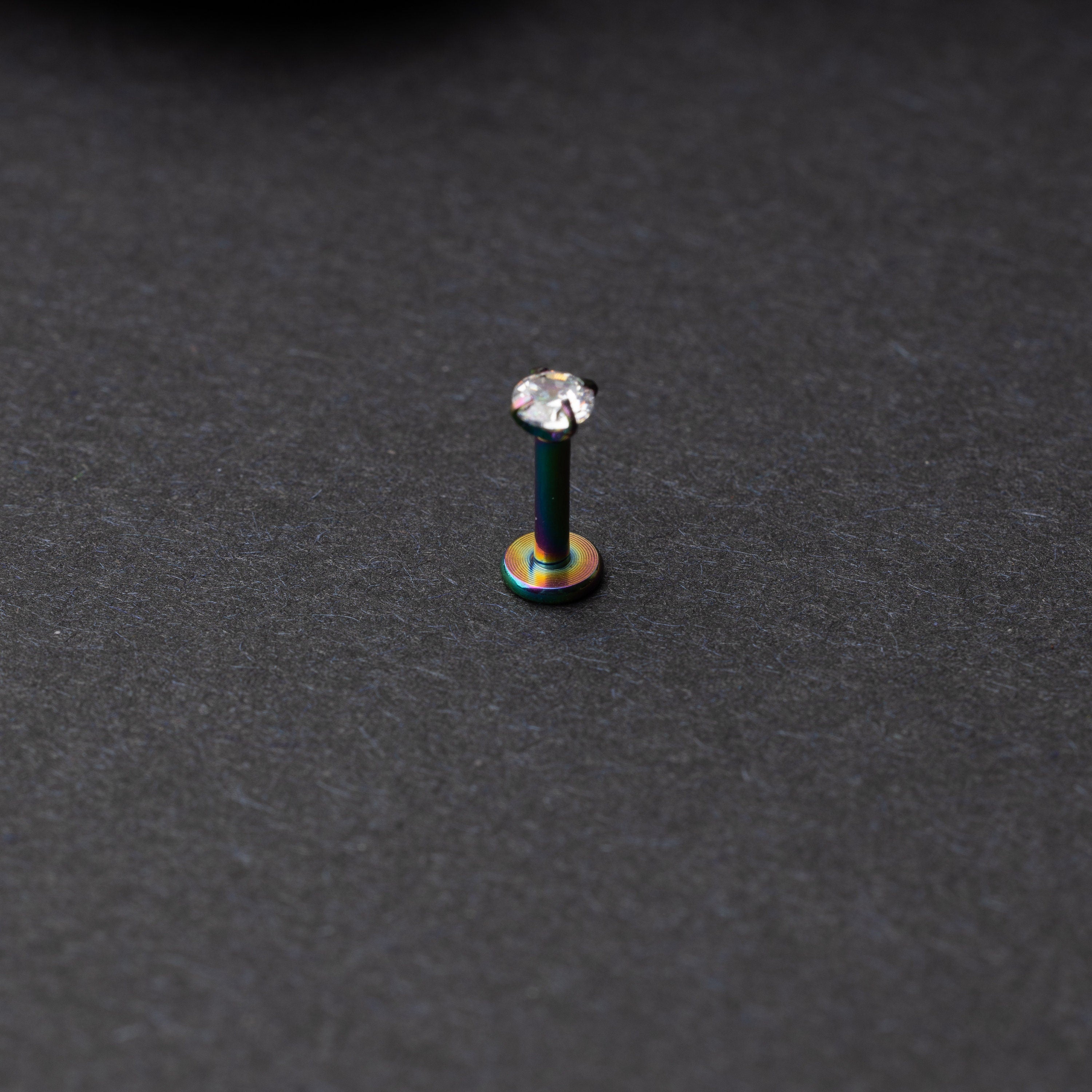 Rainbow Labret bar on a dark background