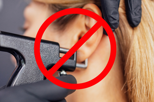 A woman getting a piercing with a gun, and a big cross over it to signify that it's a bad idea.