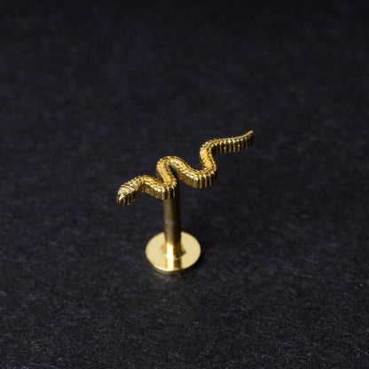 Gold-plated 925 sterling silver snake motif labret displayed on a dark background.