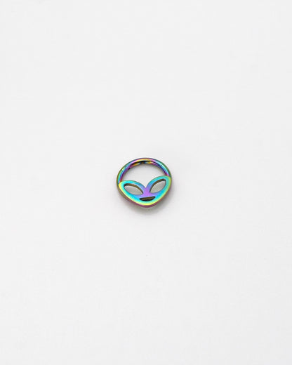 Alien-themed septum clicker in rainbow finish, displayed on a white background.