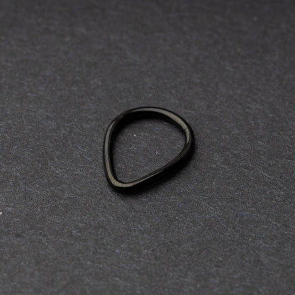 Black Teardrop Clicker displayed on a dark background