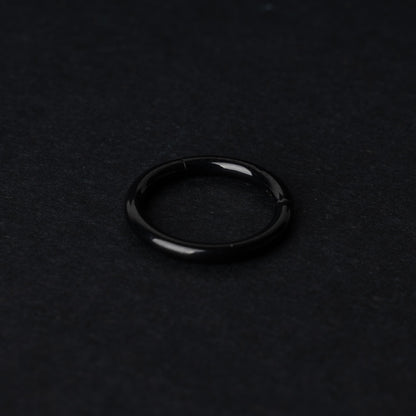 A black Seamless Clicker displayed on a dark background.