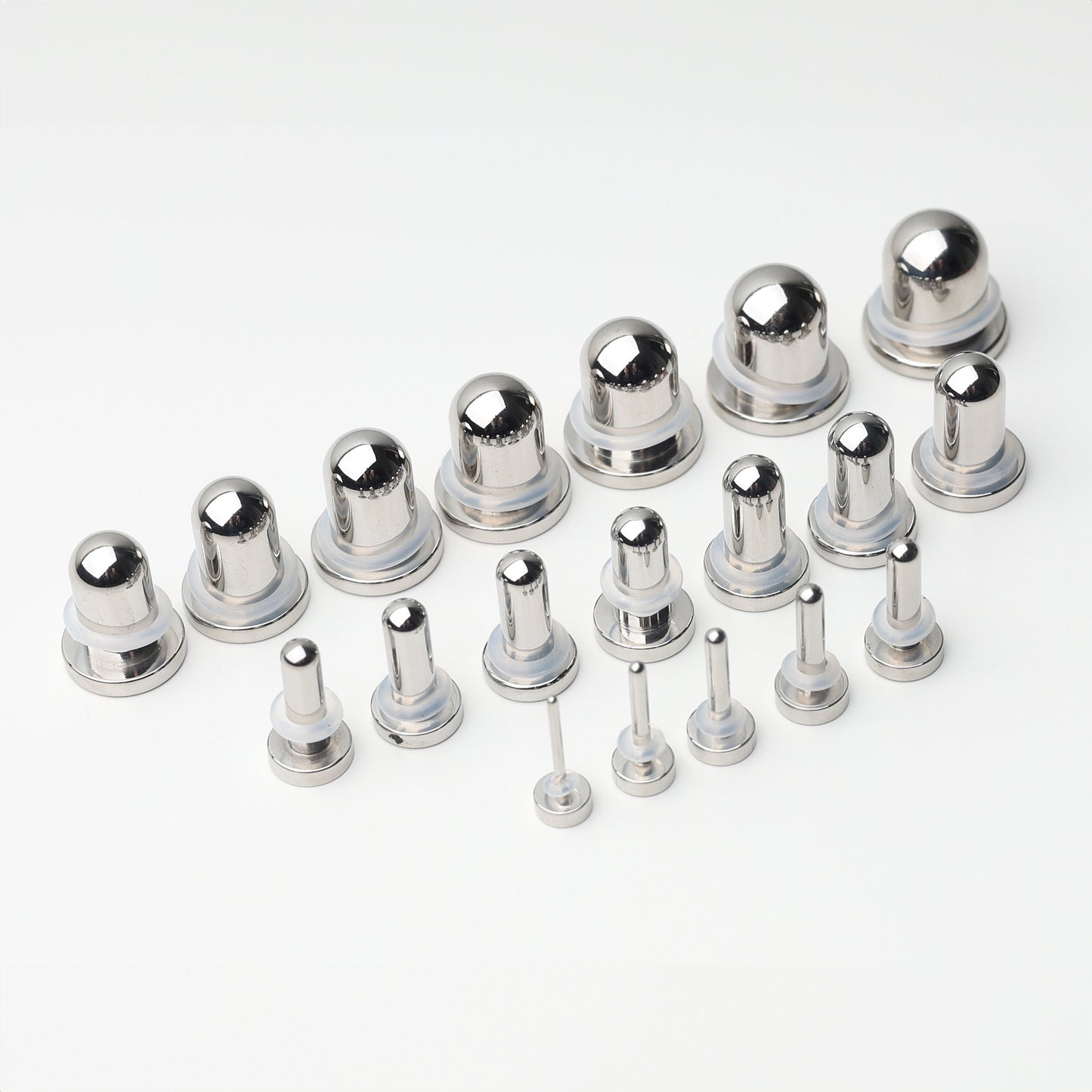 A complete dead stretching kit with polished stainless steel plugs and tunnels in multiple sizes, displayed on a white background.
