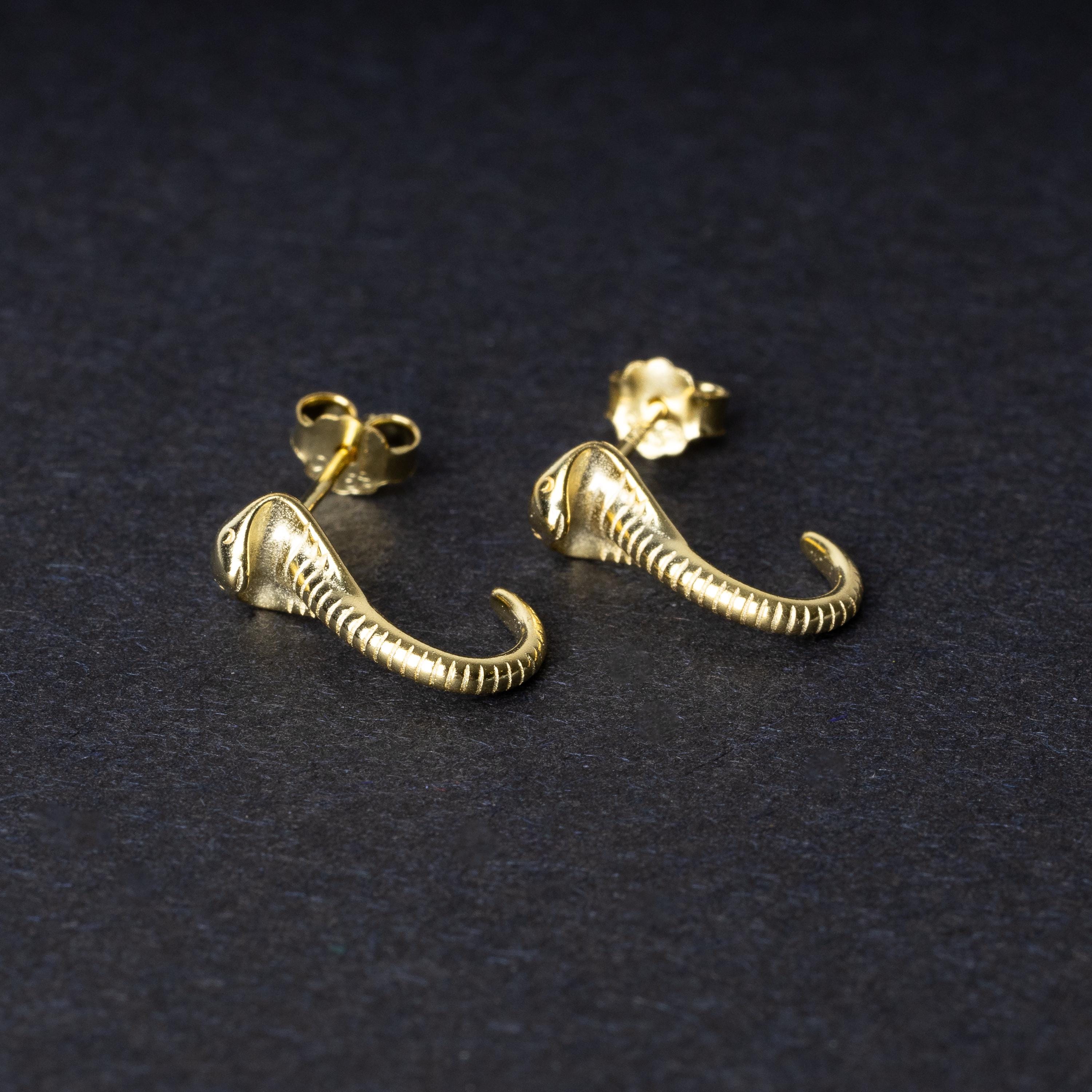 Gold-toned cobra-shaped stud earrings with intricate detailing, crafted from 925 sterling silver, displayed on a black background.