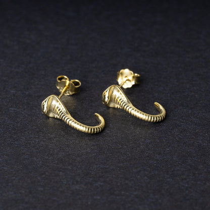 Gold-toned cobra-shaped stud earrings with intricate detailing, crafted from 925 sterling silver, displayed on a black background.