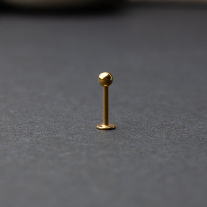 Gold Flat Back Bar displayed on a dark background.