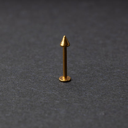 A single spiked flat back bar on a dark background. 