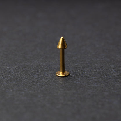 A single spiked flat back bar on a dark background. 