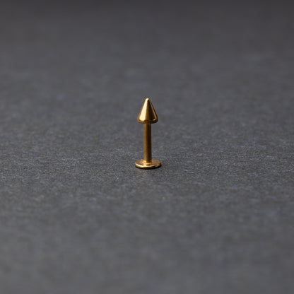 A single spiked flat back bar on a dark background. 
