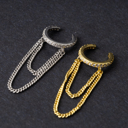 Septum clicker with double chains and gem-encrusted arc, in silver shown on a display ear. 