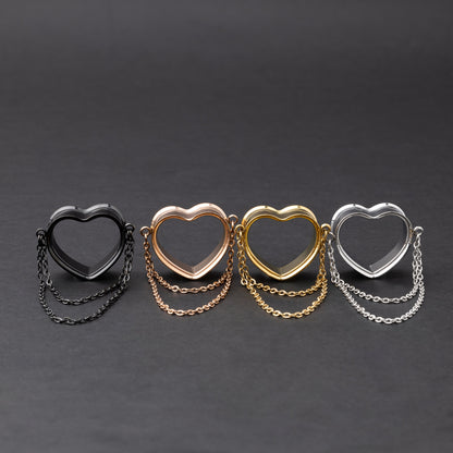 Heart-shaped tunnels with draped chains in black, rose gold, gold, and silver finishes, displayed on a dark background.