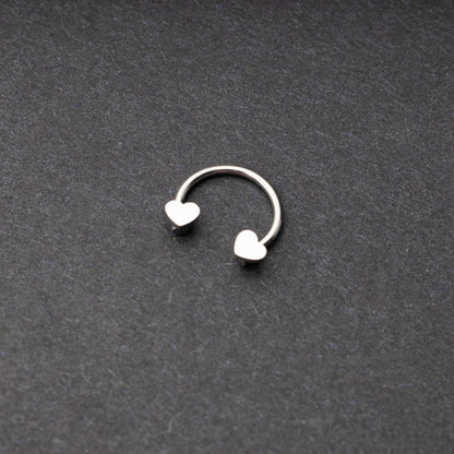 Silver Horsehoe hoop with heart ends in silver. 