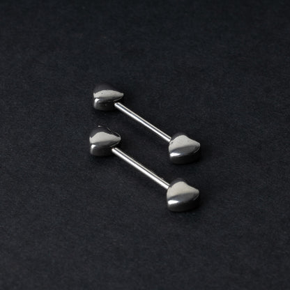 Heart-shaped silver barbells on a dark background.