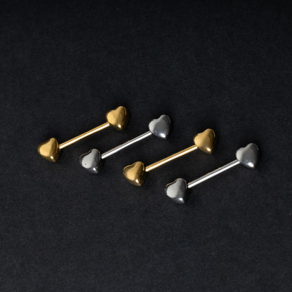 Heart-shaped silver and gold barbells on a dark background.