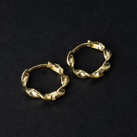 Gold-toned twisted rope design clickers made from 925 sterling silver, displayed on a black background.