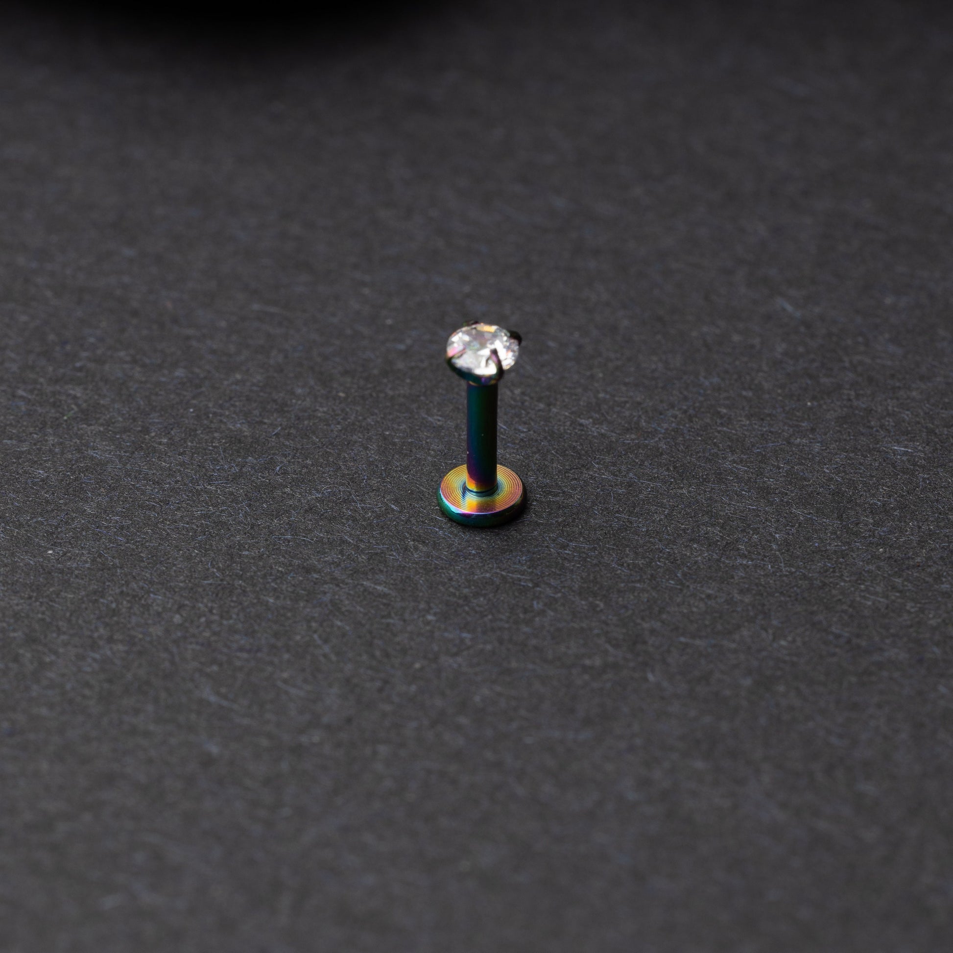 Rainbow Labret bar on a dark background