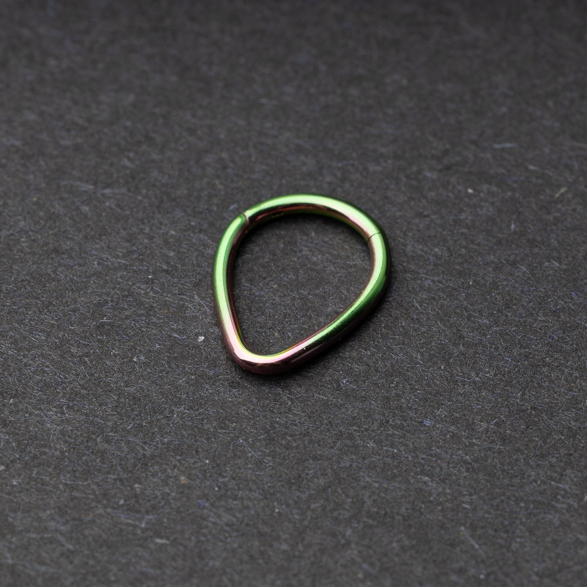Rainbow Teardrop Clicker displayed on a dark background