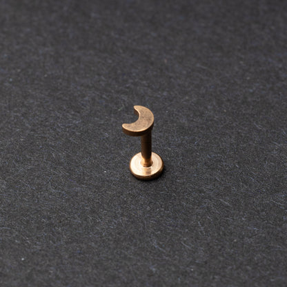 Moon flat back bar in rose gold displayed on a dark background