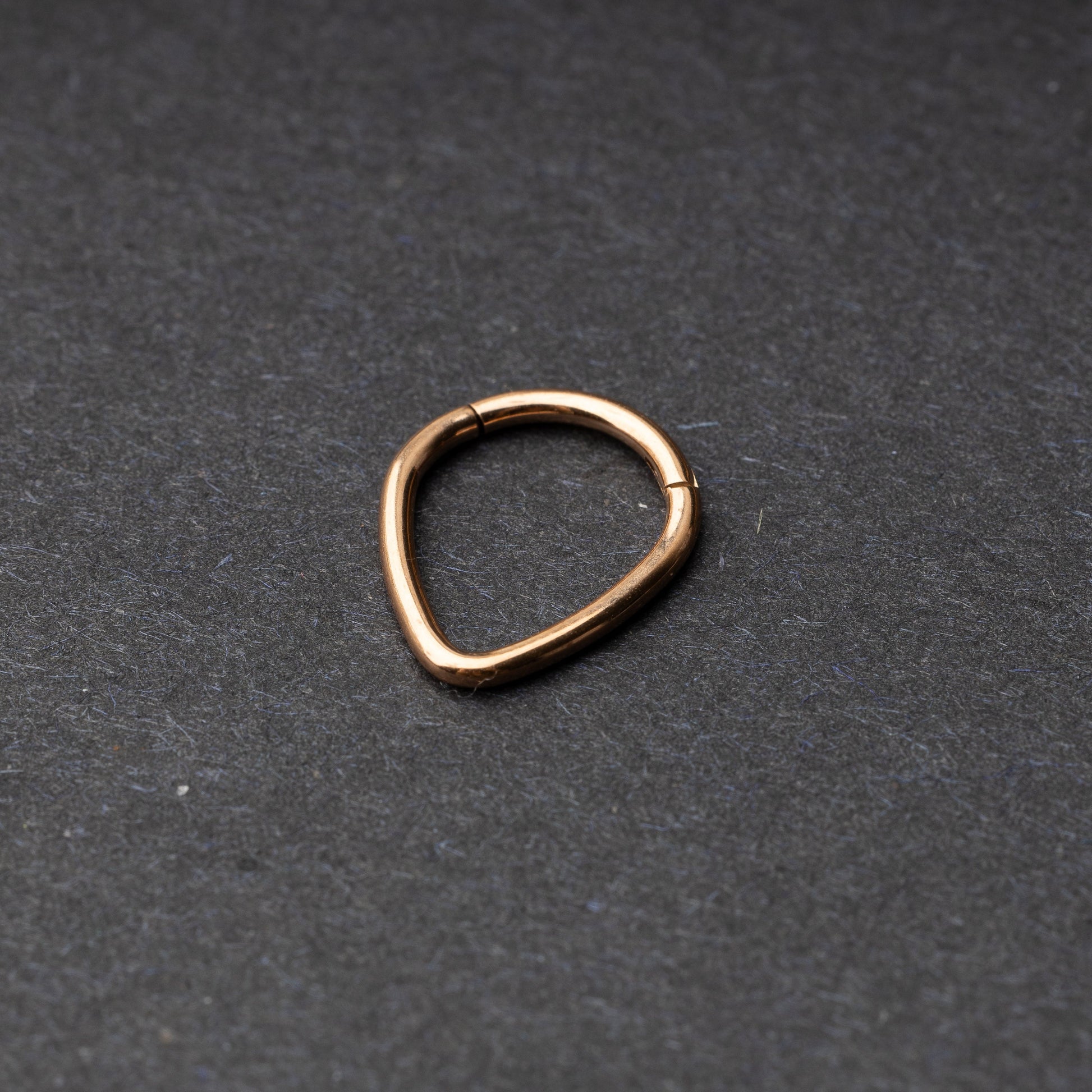 Rose Gold Teardrop Clicker displayed on a dark background