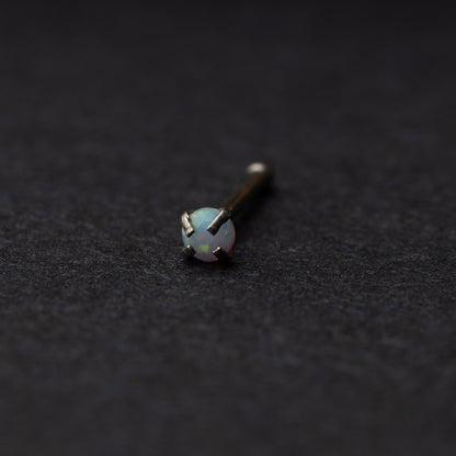 Opal nose stud displayed on a dark background