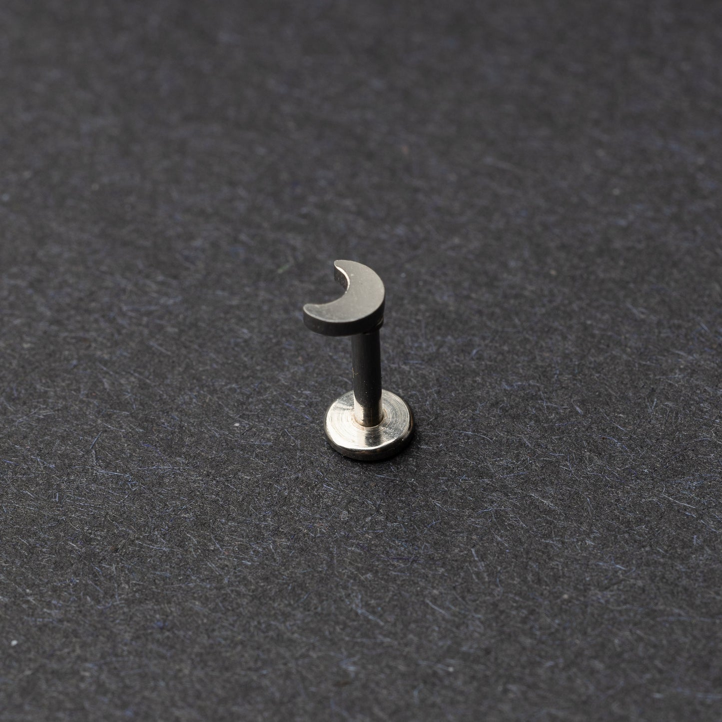 Moon flat back bar in silver displayed on a dark background