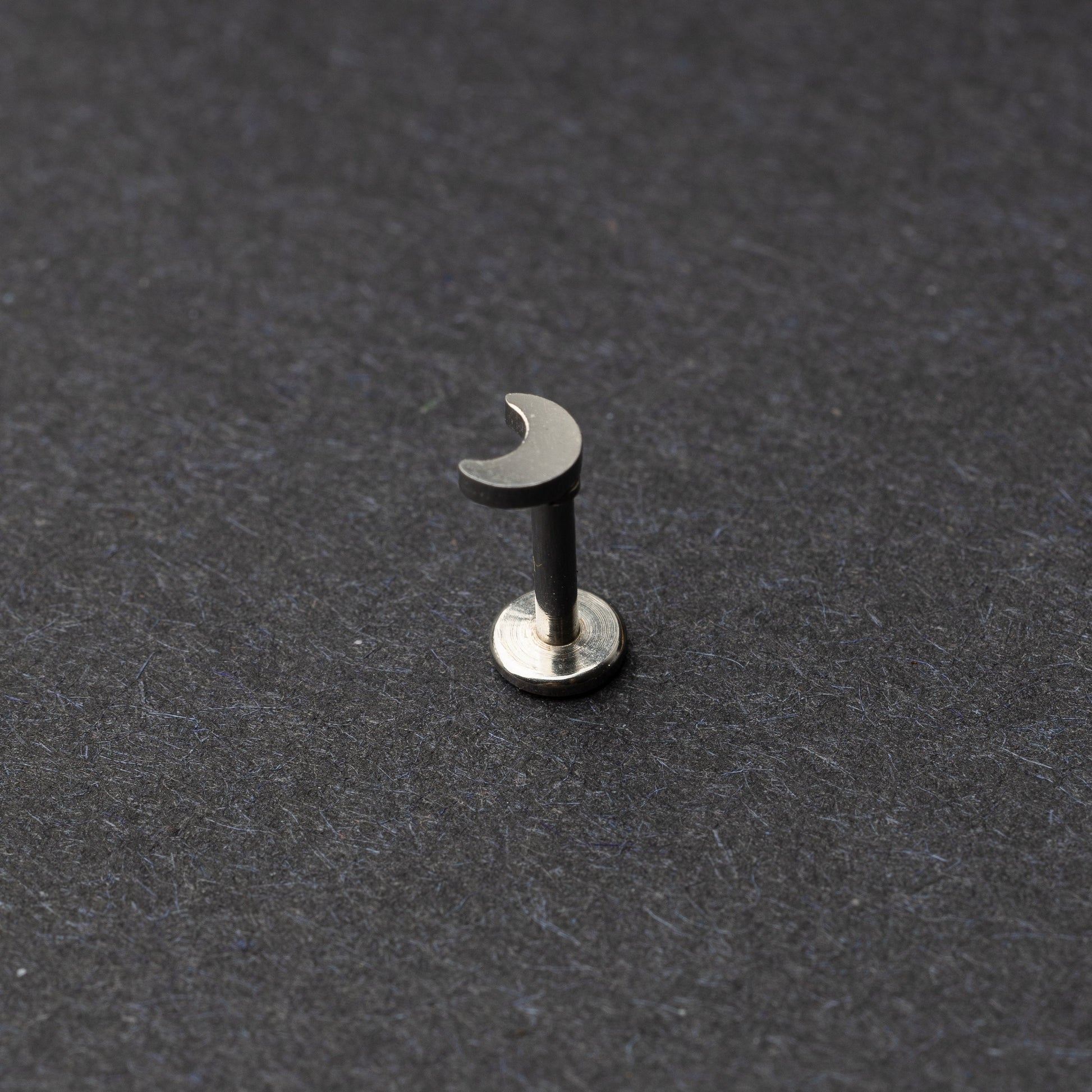 Moon flat back bar in silver displayed on a dark background